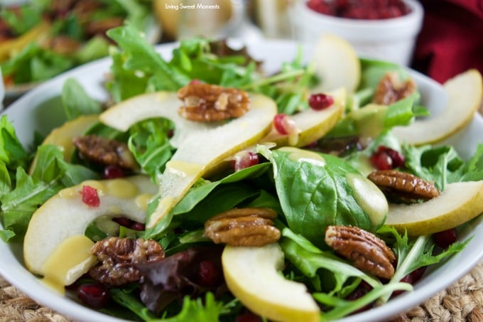 This tasty pomegranate Pear Salad is served with candied pecans and drizzled with a mustard dressing. The perfect autumn quick salad to serve with dinner.