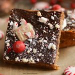 These soft and chewy Peppermint Blondies are covered in chocolate and sprinkled with candy. The perfect Holiday dessert recipe for parties and celebrations.