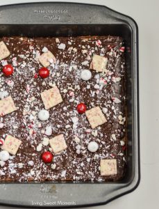 These soft and chewy Peppermint Blondies are covered in chocolate and sprinkled with candy. The perfect Holiday dessert recipe for parties and celebrations.