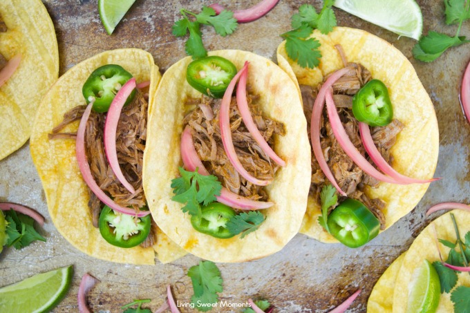 This scrumptious beef barbacoa tacos recipe is made quickly in the pressure cooker and served with homemade pickled onions. Perfect for dinner and parties.
