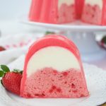 This decadent strawberry Flan Jello Cake Recipe is a 3 in 1. A Cake and flan encased in a refreshing jello shell. A showstopper dessert for any occasion.