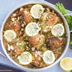 This delicious One Pot Chicken And Rice recipe is seasoned with za'atar and topped with lemon, almonds, and parsley. A delicious quick dinner idea.