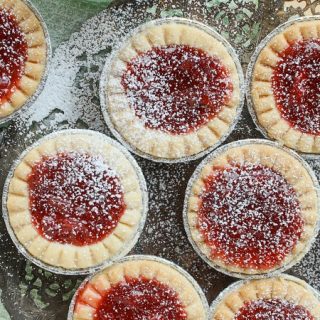 These delicious and tangy Strawberry Rhubarb Tarts are super easy to make and are the perfect mini desserts for any party. Top them with powdered sugar.