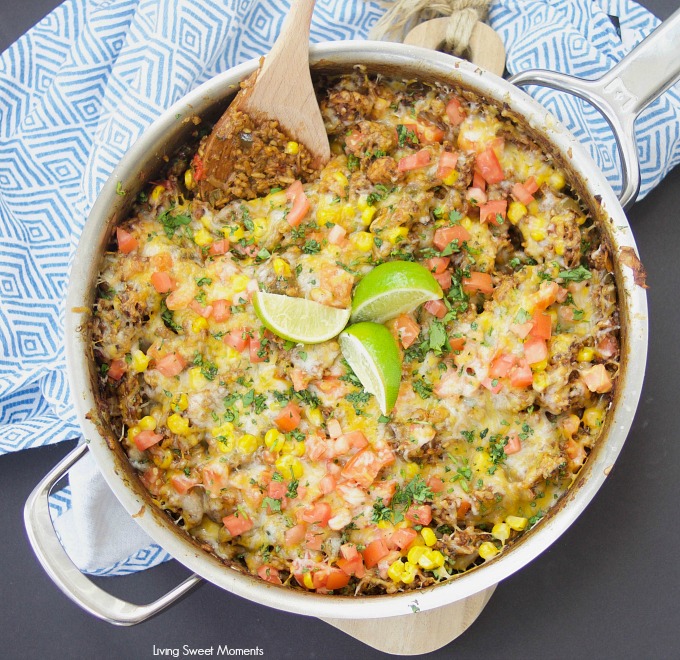 This amazing one pot cheesy Mexican Chicken And Rice recipe is made with authentic Mexican Mole sauce & topped with sesame seeds, for a quick 30-minute meal