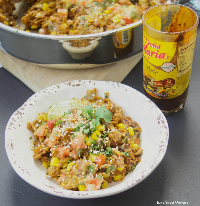 This amazing one pot cheesy Mexican Chicken And Rice recipe is made with authentic Mexican Mole sauce & topped with sesame seeds, for a quick 30-minute meal