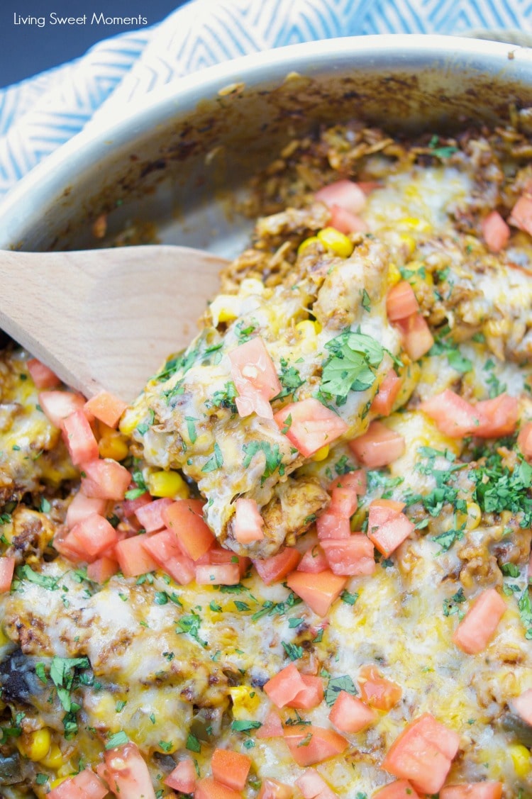 This amazing one pot cheesy Mexican Chicken And Rice recipe is made with authentic Mexican Mole sauce & topped with sesame seeds, for a quick 30-minute meal