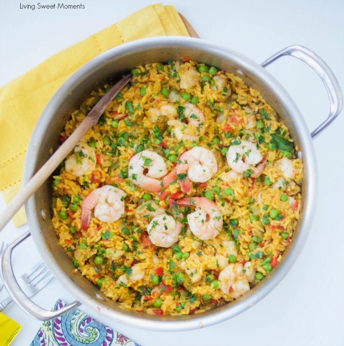 This delicious Spanish Shrimp With Yellow Rice recipe is super easy to make, ready in less than an hour, & feeds a crowd. Perfect for dinner or entertaining