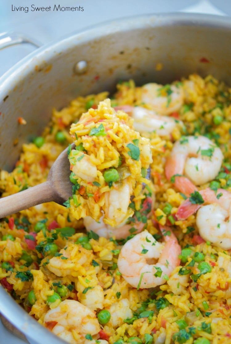 This delicious Spanish Shrimp With Yellow Rice recipe is super easy to make, ready in less than an hour, & feeds a crowd. Perfect for dinner or entertaining