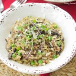 This amazing and creamy wild mushroom quinoa risotto recipe is super easy, vegetarian and is made with leeks & green peas for great color & flavor.