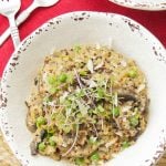 This amazing and creamy wild mushroom quinoa risotto recipe is super easy, vegetarian and is made with leeks & green peas for great color & flavor.