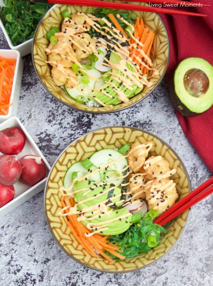 This delicious spicy shrimp poke bowl recipe is served with hot sushi rice, spicy mayo, avocados, radishes, and carrots. A quick weeknight dinner idea