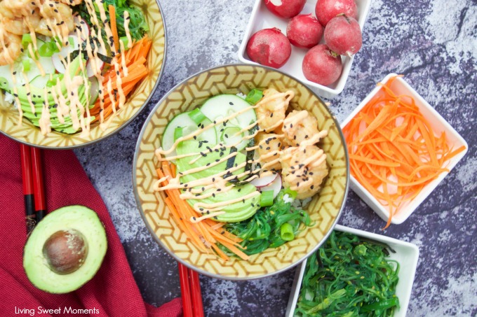 This delicious spicy shrimp poke bowl recipe is served with hot sushi rice, spicy mayo, avocados, radishes, and carrots. A quick weeknight dinner idea