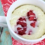 This moist and delicious Raspberry Sour Cream Mug Cake recipe is ready in 4 minutes or less and is topped with a yummy Vanilla Glaze. A quick dessert idea