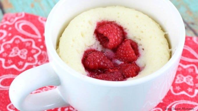 This moist and delicious Raspberry Sour Cream Mug Cake recipe is ready in 4 minutes or less and is topped with a yummy Vanilla Glaze. A quick dessert idea