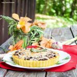 This delicious Summer Vegetable Tart recipe is filled with corn, shallots, mushrooms, creme fraiche and shredded gruyere cheese. A perfect vegetarian entree