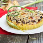 This delicious Summer Vegetable Tart recipe is filled with corn, shallots, mushrooms, creme fraiche and shredded gruyere cheese. A perfect vegetarian entree