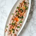 Entertain in style! This savory Black Eyed Pea Hummus recipe is the perfect appetizer to serve with pita chips and crackers. A delicious flavorful spread. Whole narrow white dish