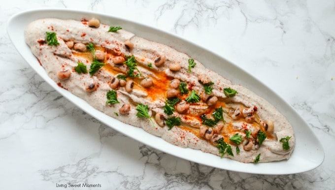 Entertain in style! This savory Black Eyed Pea Hummus recipe is the perfect appetizer to serve with pita chips and crackers. A delicious flavorful spread. White long dish