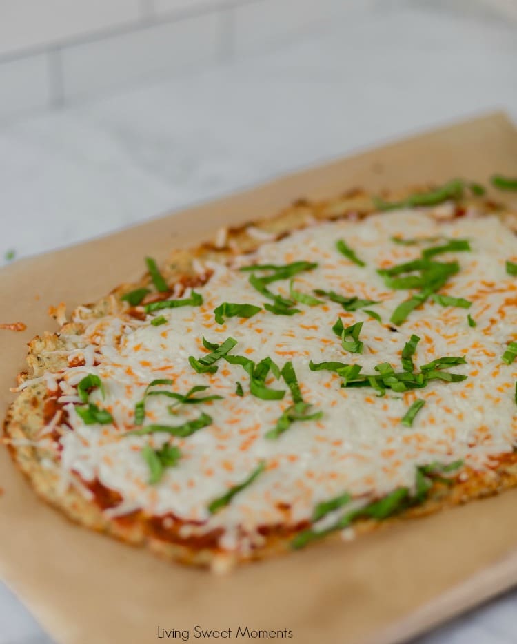 This keto friendly Cauliflower Pizza Crust is crispy, delicious, low-carb, and super easy to make. Top with your favorite sauce and veggies & it'll be a hit