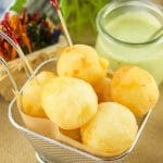 These amazing Cheese Stuffed Yuca Balls are crispy, delicate, and so cheesy! Served with a cilantro aioli. Perfect as bite-size appetizers for entertaining.