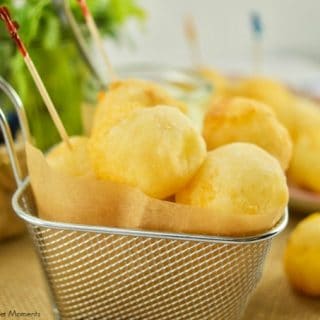 These amazing Cheese Stuffed Yuca Balls are crispy, delicate, and so cheesy! Served with a cilantro aioli. Perfect as bite-size appetizers for entertaining.
