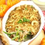 I've fancied up a classic Thanksgiving dish. This creamy Green Bean Casserole From Scratch recipe has lot's of onions, mushrooms, and green beans, & Gruyere cheese. Green beans facing out showing the creamy interior