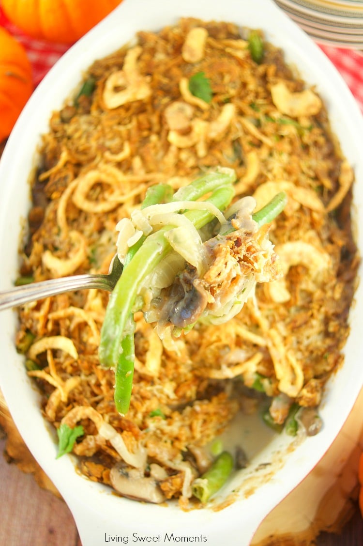 I've fancied up a classic Thanksgiving dish. This creamy Green Bean Casserole From Scratch recipe has lot's of onions, mushrooms, and green beans, & Gruyere. A Spoon showing the interior of the casserole