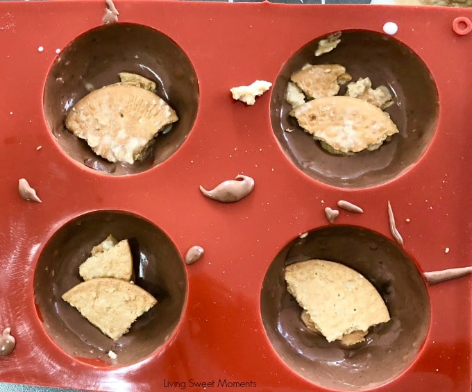 This decadent No Bake Chocolate Biscuit Cake recipe process showing the biscuits in the chocolate 