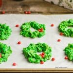 These easy and delicious Christmas Wreath Cookies require no baking & few ingredients. Perfect to make with kids. Give them out as gifts or for dessert.