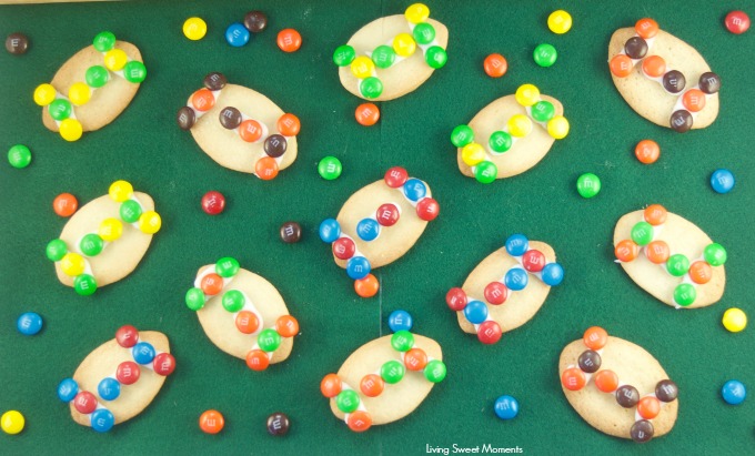 These fun M&M Football Cookies are the perfect kid friendly treat for the Superbowl, tailgating parties, sporting events and more. Use your favorite team colors to decorate