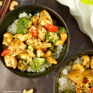 This quick and easy Instant Pot Cashew Chicken recipe served with white rice and sprinkled with sesame seeds