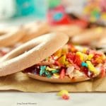 Yummy crunchy Fruity Pebbles Rice Cakes Sandwiches an easy to make snack that kids love. A closeup of the sandwich with cereal