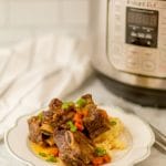 picture of instant pot short ribs with the appliance on the back