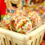 Celebrate Easter with these delicious no-bake Fruity Pebbles Eggs topped with a tangy lemon glaze. The perfect kid-friendly treat! Closeup shot