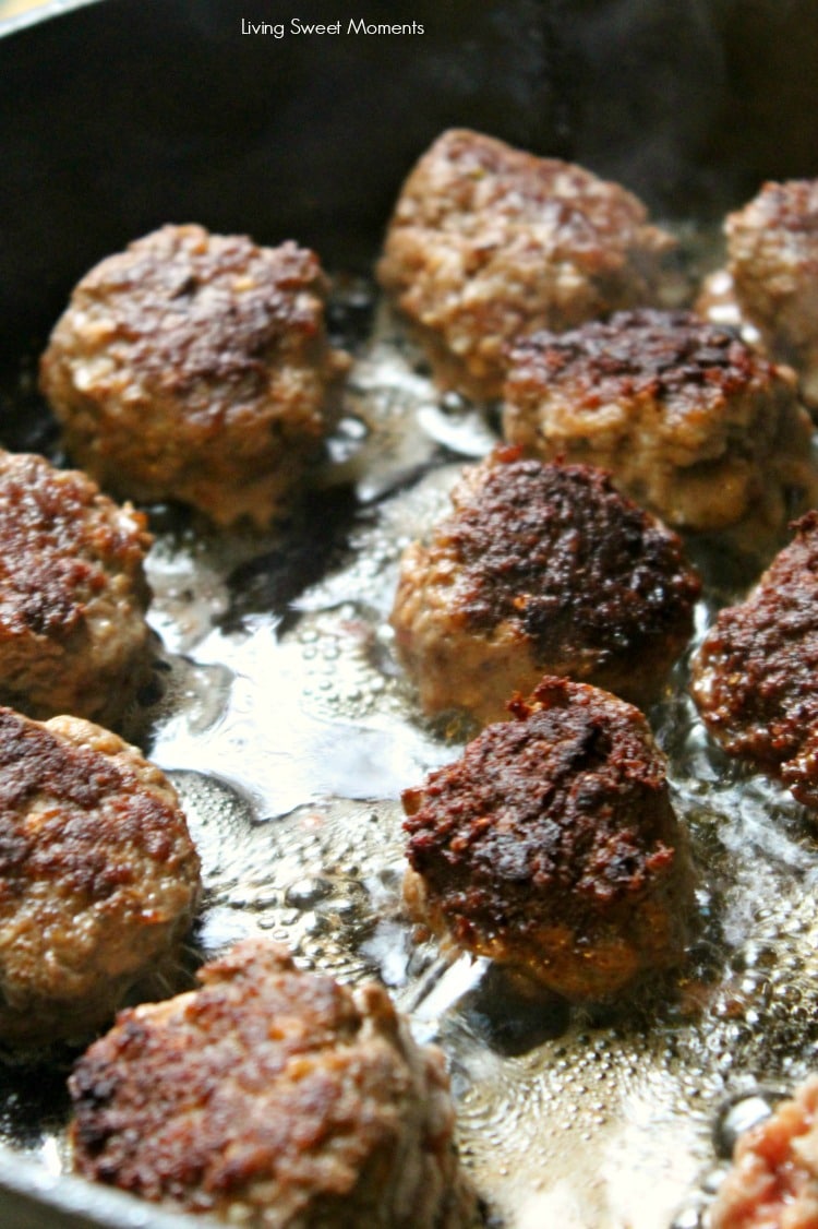 Delicious One Pot Greek Meatballs. Pictures shows meatballs browning in the pan with oil