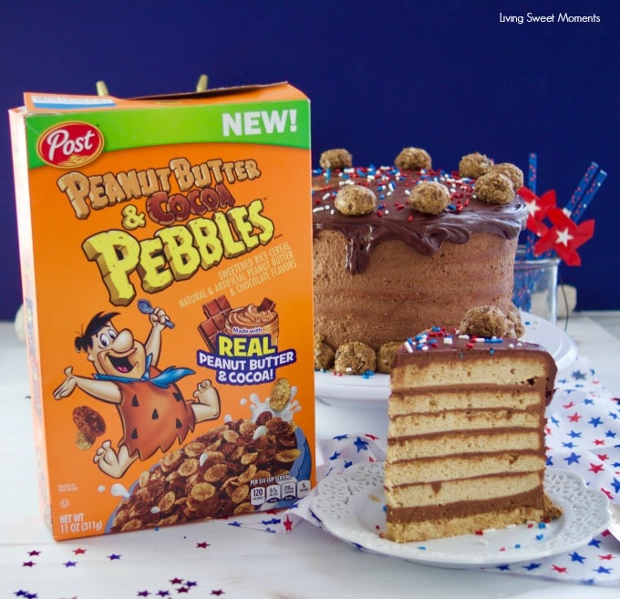 This colossal Peanut Butter Chocolate Cake recipe is made from scratch and is garnished with peanut butter truffles. Made with Peanut butter & cocoa Pebbles cereal