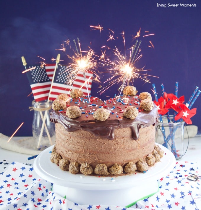 This colossal Peanut Butter Chocolate Cake recipe is made from scratch and is showing as the ultimate celebration cake for the 4th of july