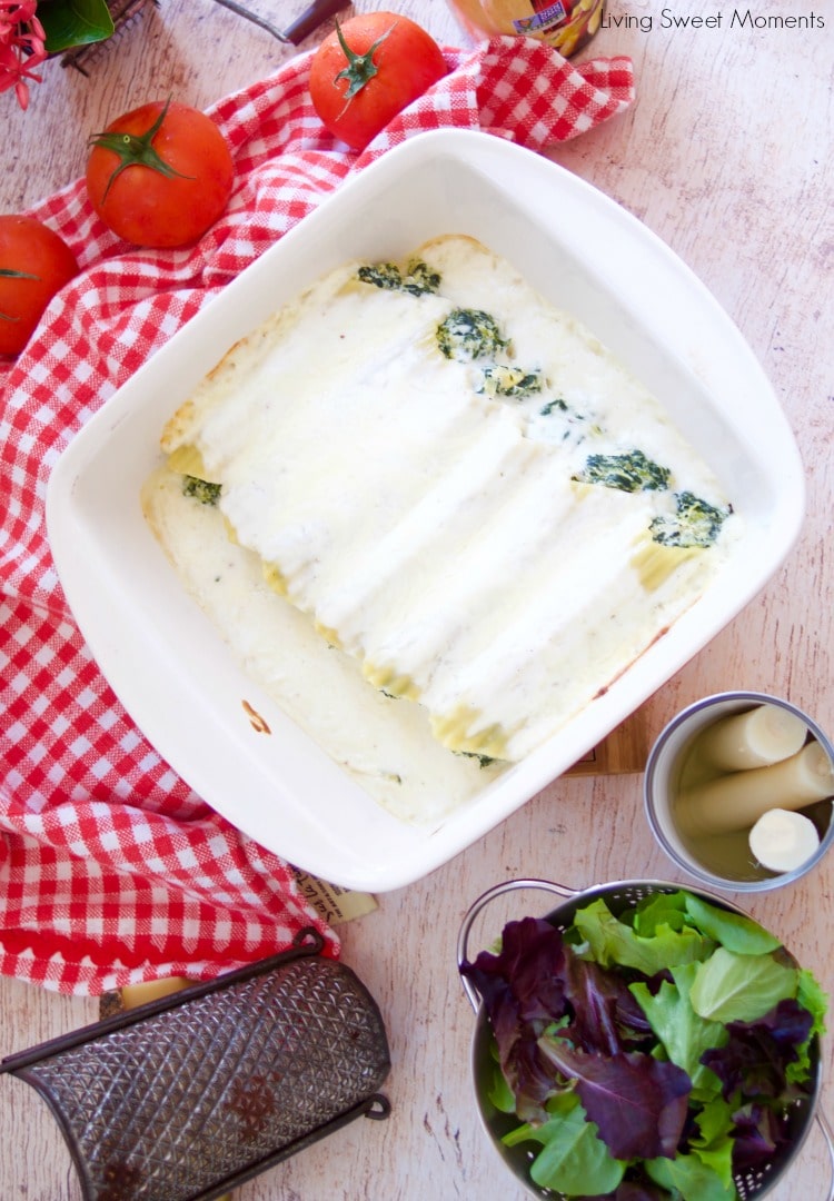 Enjoy a delicious vegetarian comfort dinner under an hour with this cheesy Spinach Artichoke Manicotti baked in a rich Bechamel sauce and hearts of palm