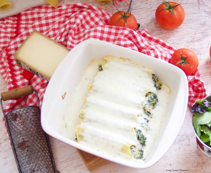 Enjoy a delicious vegetarian comfort dinner under an hour with this cheesy Spinach Artichoke Manicotti with bechamel sauce and mozarella cheese