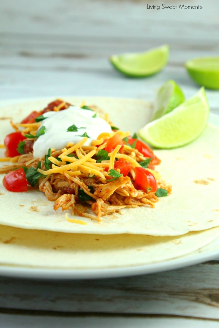 You won't believe how easy these Slow Cooker Shredded Chicken Tacos are to make. Serve in a warm tortilla with cheese, veggies, and sour cream