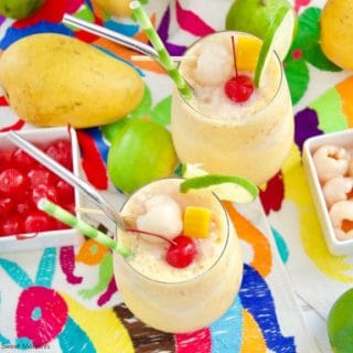 These refreshing Mango Lychee Wine Slushies have a touch of acid and garnished with a bamboo straw