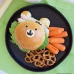 Check out how to make these delicious & adorable Teddy Bear Sandwich Buns served with carrots, and pretzels. Perfect to take to school