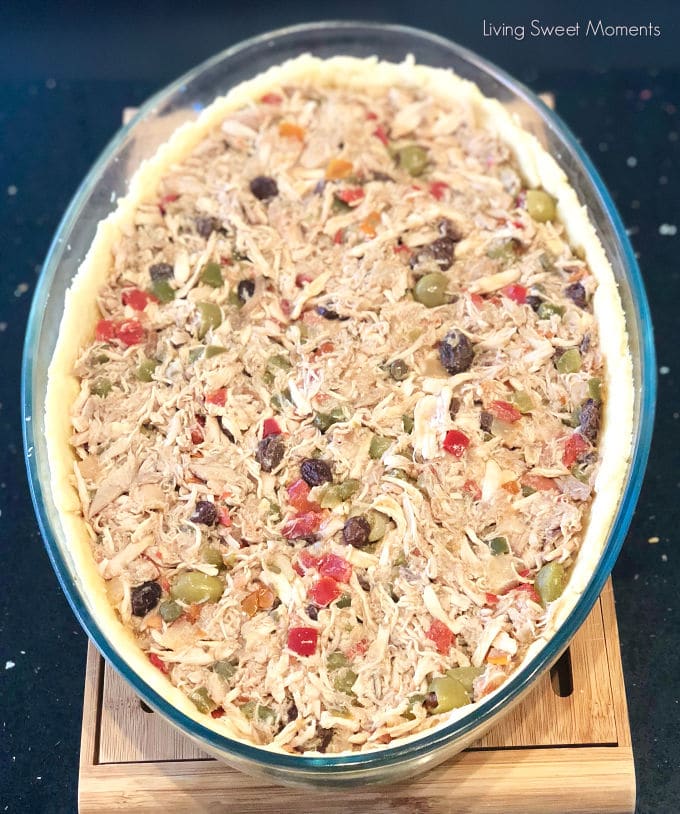 This savory shortcrust chicken pie (Polvorosa de Pollo) is made Venezuelan style by filling it with yummy shredded chicken, olives, raisins, and capers.