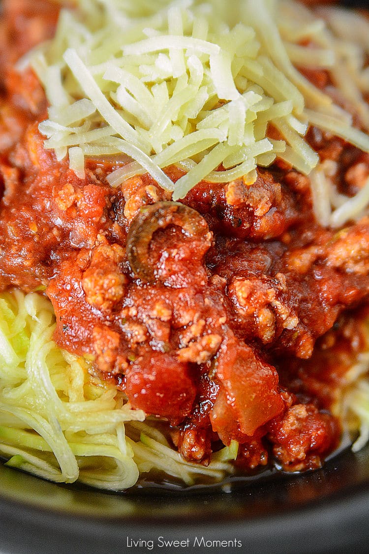 Come home to a delicious and comforting meal. This hearty Slow Cooker Sausage Puttanesca is served with zoodles. The perfect low-carb weeknight dinner idea.