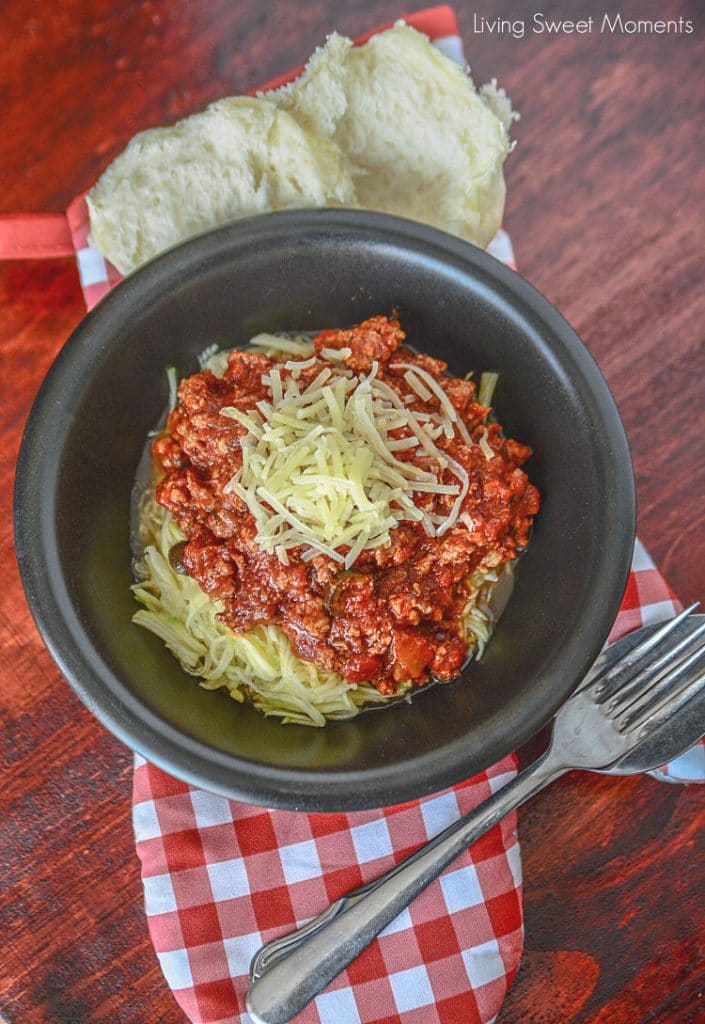 Come home to a delicious and comforting meal. This hearty Slow Cooker Sausage Puttanesca is served with zoodles. The perfect low-carb weeknight dinner idea.