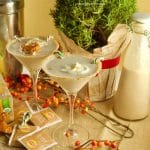 Get in the Holiday spirit with this creamy and flavorful Chai Tea Eggnog Cocktail served on a martini glass and garnished with fresh whipped cream.