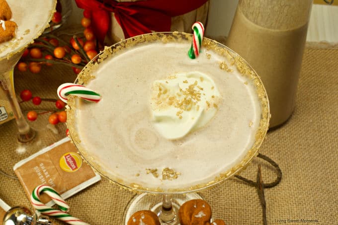 Get in the Holiday spirit with this creamy and flavorful Chai Tea Eggnog Cocktail served on a martini glass and garnished with fresh whipped cream.