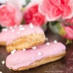 These delicate vanilla eclairs features a crunchy pate au choux filled homemade vanilla pastry cream and topped with a sweet glaze. A classic french pastry.