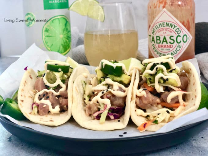 Delight your friends with these delicious Asian Style Tuna Tacos. Marinated ahi tuna is served over an asian slaw, avocados, and covered with spicy mayo.