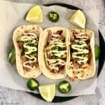 Delight your friends with these delicious Asian Style Tuna Tacos. Marinated ahi tuna is served over an asian slaw, avocados, and covered with spicy mayo.